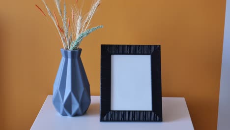 stylish interior decor with a photo frame and vase