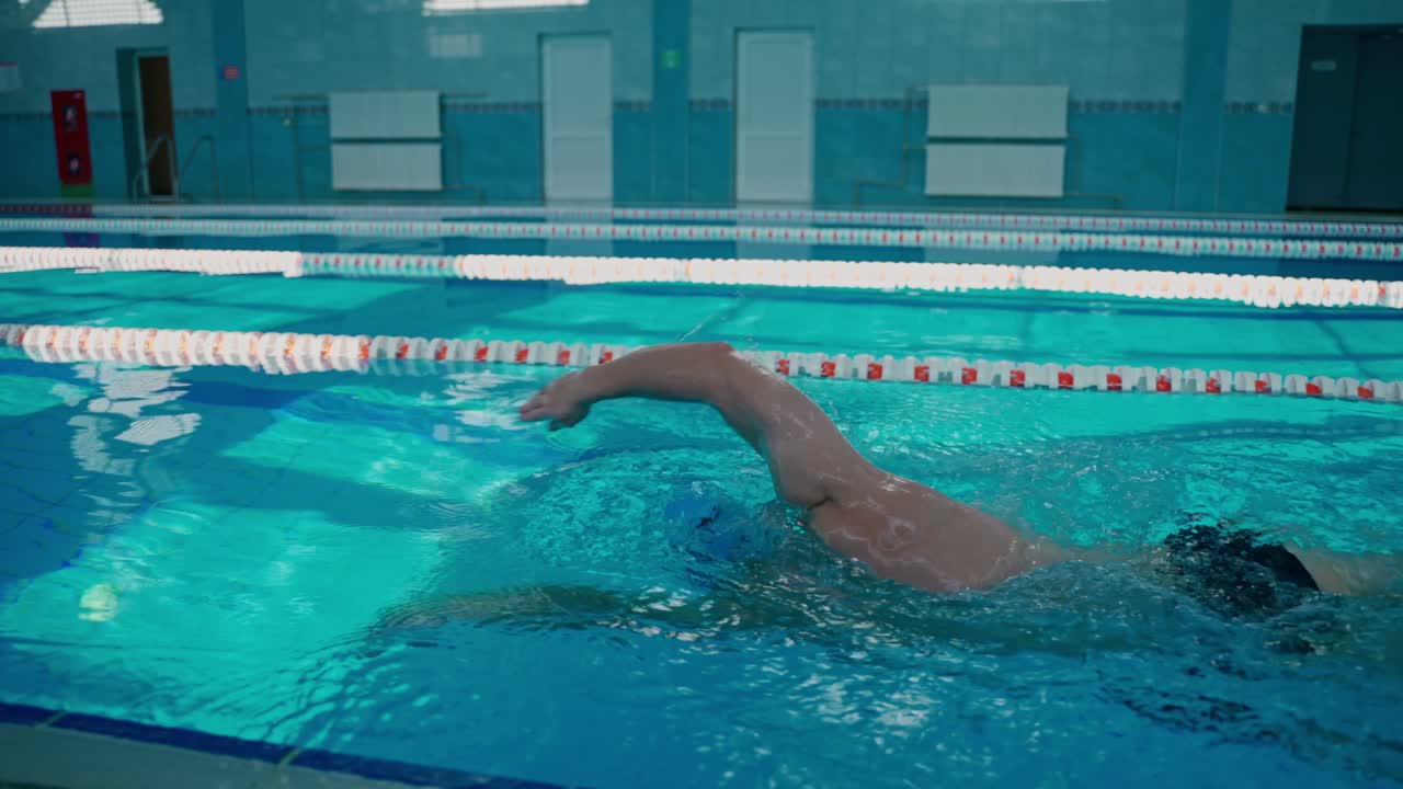 Swimmer in an Indoor Swimming Pool