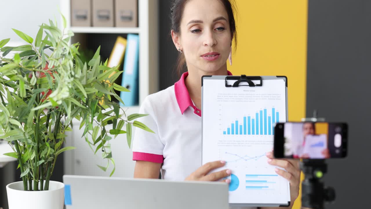 Woman Presenting Business Data Online via Video Call