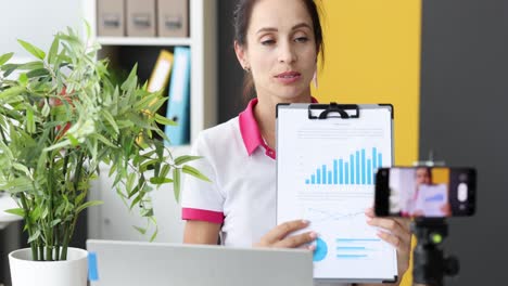 woman presenting business data online via video call