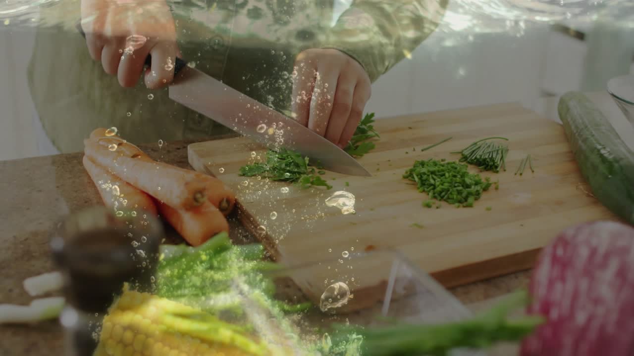 Water effect fading and revealing countertop, woman chopping herbs on cutting board for meal prep