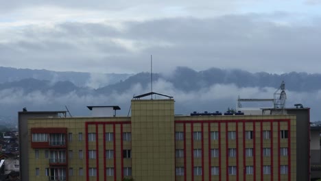 view of tall buildings with stunning natural mist in the morning, sukabumi, west java, indonesia