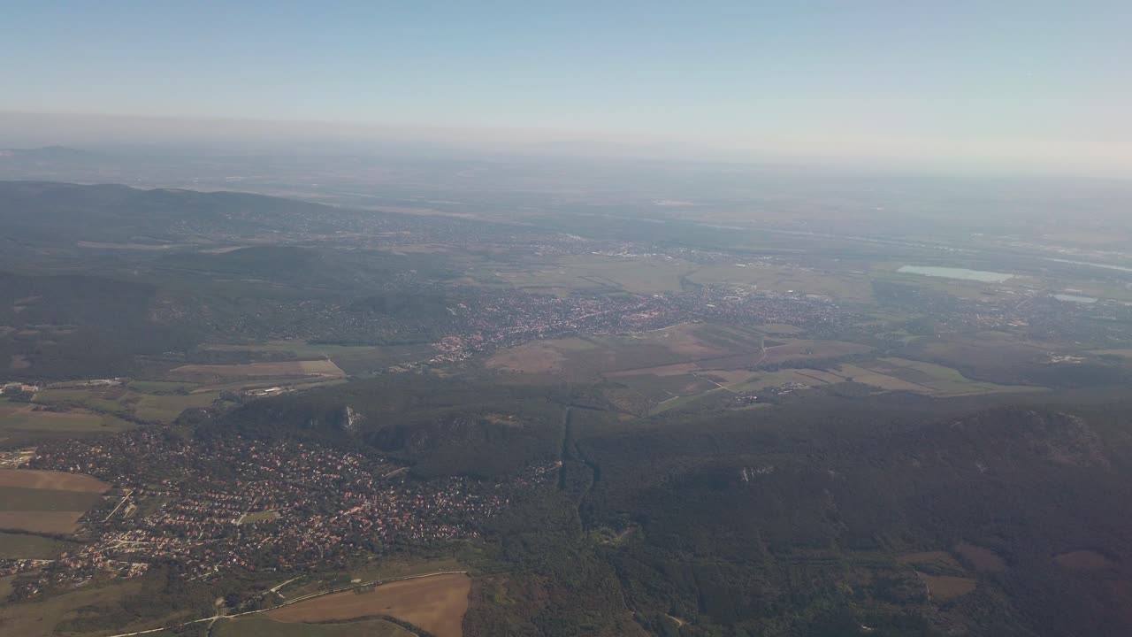 Hills and mountains northeast of Budapest filmed from a descending airplane