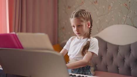 Girl-in-orthopedic-corset-finishes-playing-piano-at-home