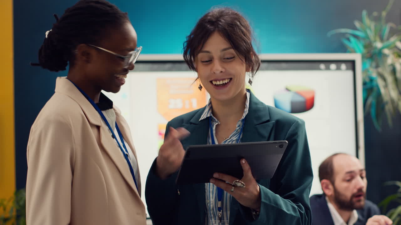 Corporate workers looking into project updates and timelines in boardroom