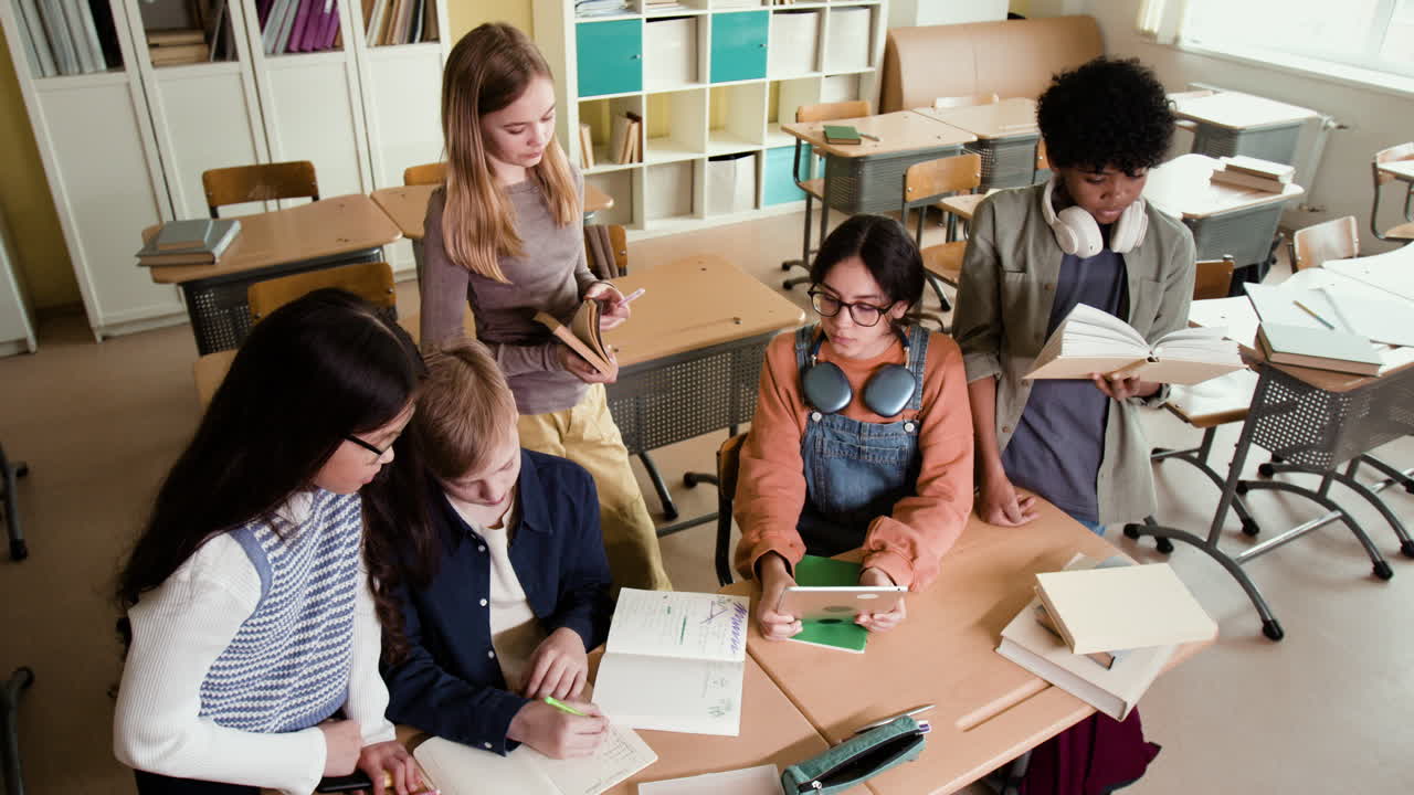 Diverse group of students studying and collaborating in a classroom