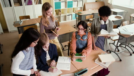 diverse group of students studying and collaborating in a classroom