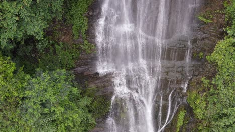 aerial: waterfall cascade in yangshuo county karst mountains