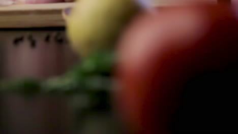 close-up of hands chopping red onion for cooking