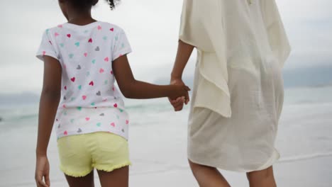 family enjoying free time by the sea