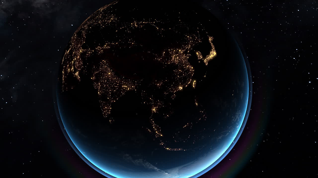 Nighttime satellite view of Asia glowing with city lights from space