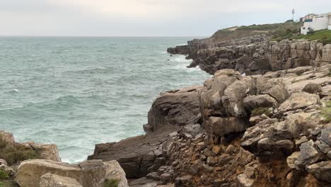 slow motion of the waves shocking with the cliff at portugal coast