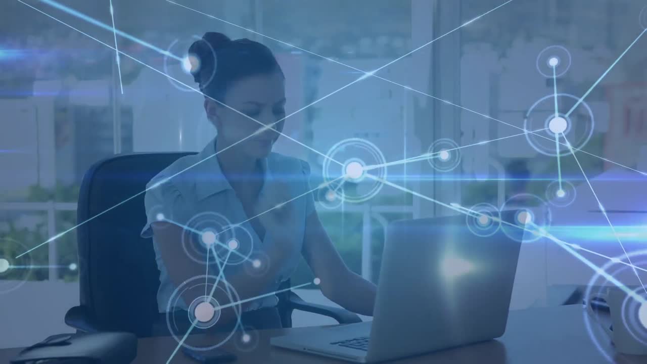 Animation of network of connections over caucasian businessman working on laptop