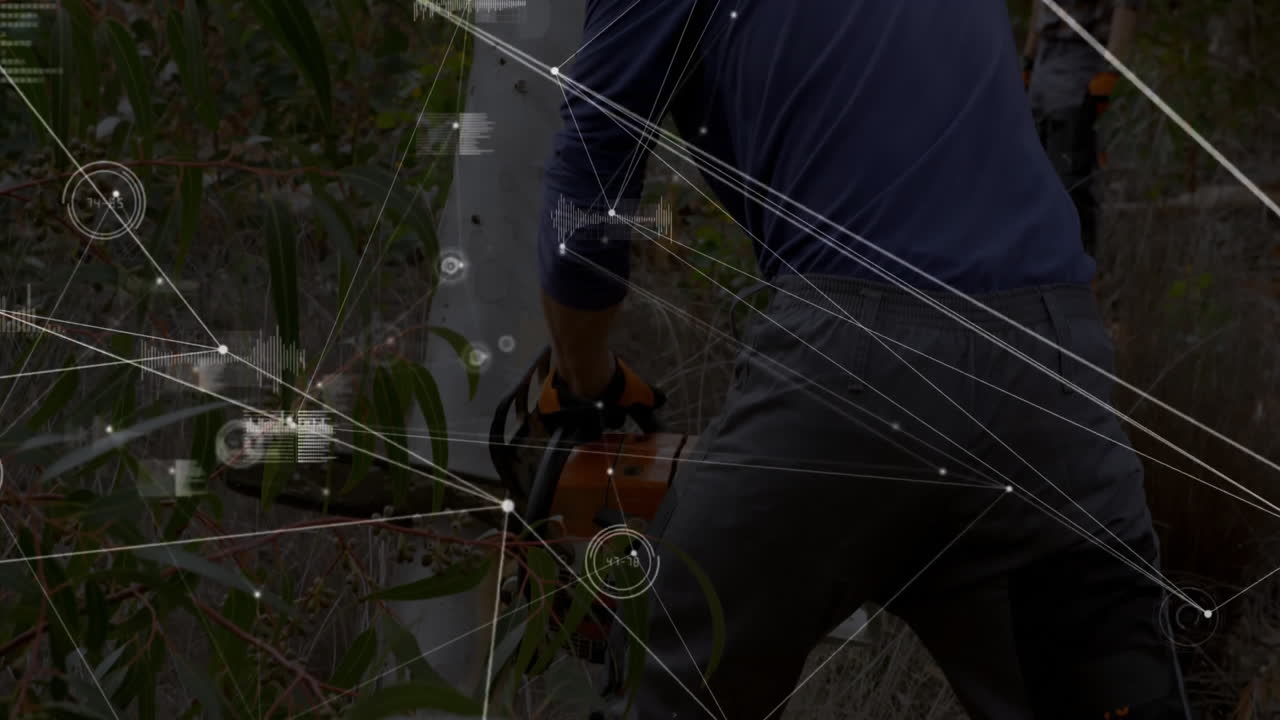 Worker operating chainsaw in forest, displaying tech overlay with forestry data charts