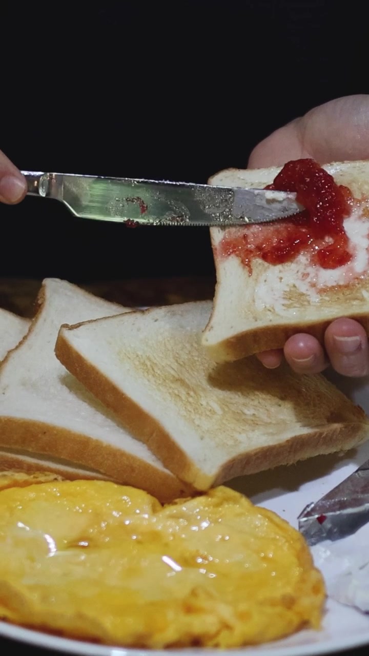 Spreading jam on buttered toast over time