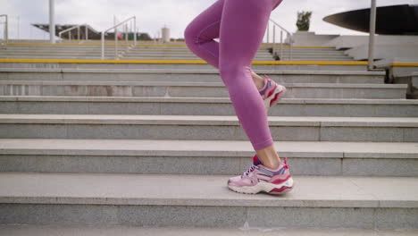 woman running up stairs