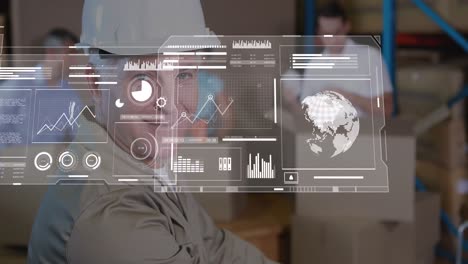 Animation-of-globes,-graphs,-loading-bars-over-caucasian-man-keeping-cardboard-box-on-table