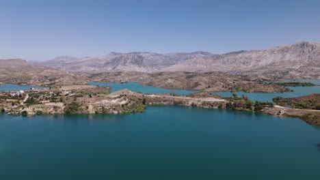 cinematic establishing view of green lake, taurus mountains turkey at midday