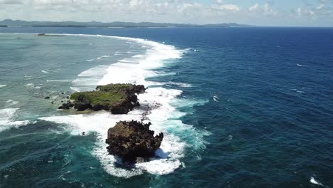bird's eye shot over the ocean ecstacy, rock island, on siargao island
