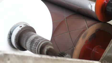 Close-Up-View-Of-Plastic-Cellophane-Bags-Going-Through-Rollers-At-Factory