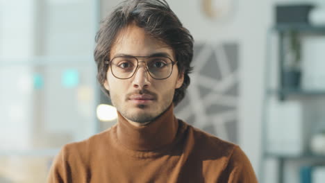 portrait of young middle eastern man in office