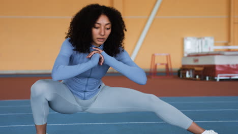 woman stretching indoors