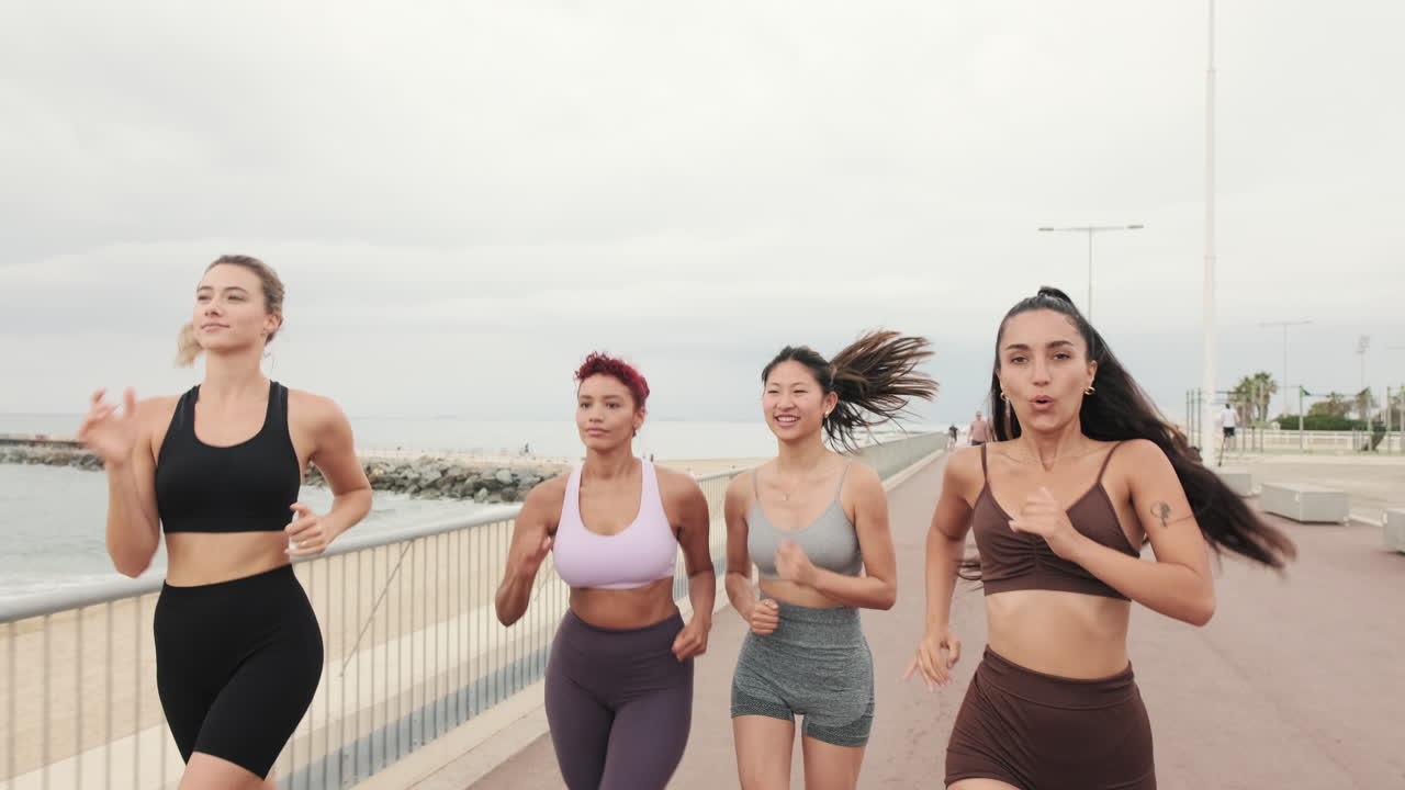 Four Women Jogging by The Beach