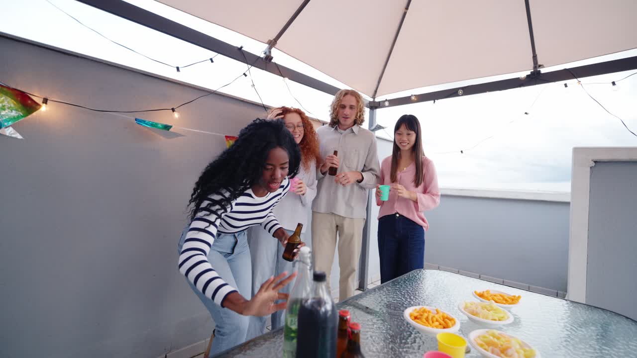 Group of friends having a rooftop party