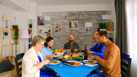 Zoom-in-shot-of-family-enjoying-a-good-red-wine