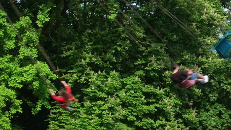 an amusement in the city park, chair swing ride.