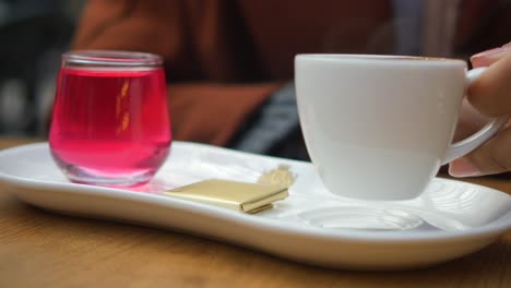 enjoying a cup of turkish coffee with a sweet treat