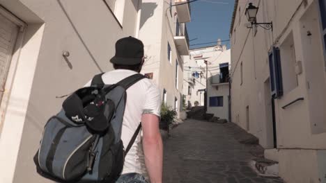 slow motion, millennial traveler walking up narrow european alleyway street