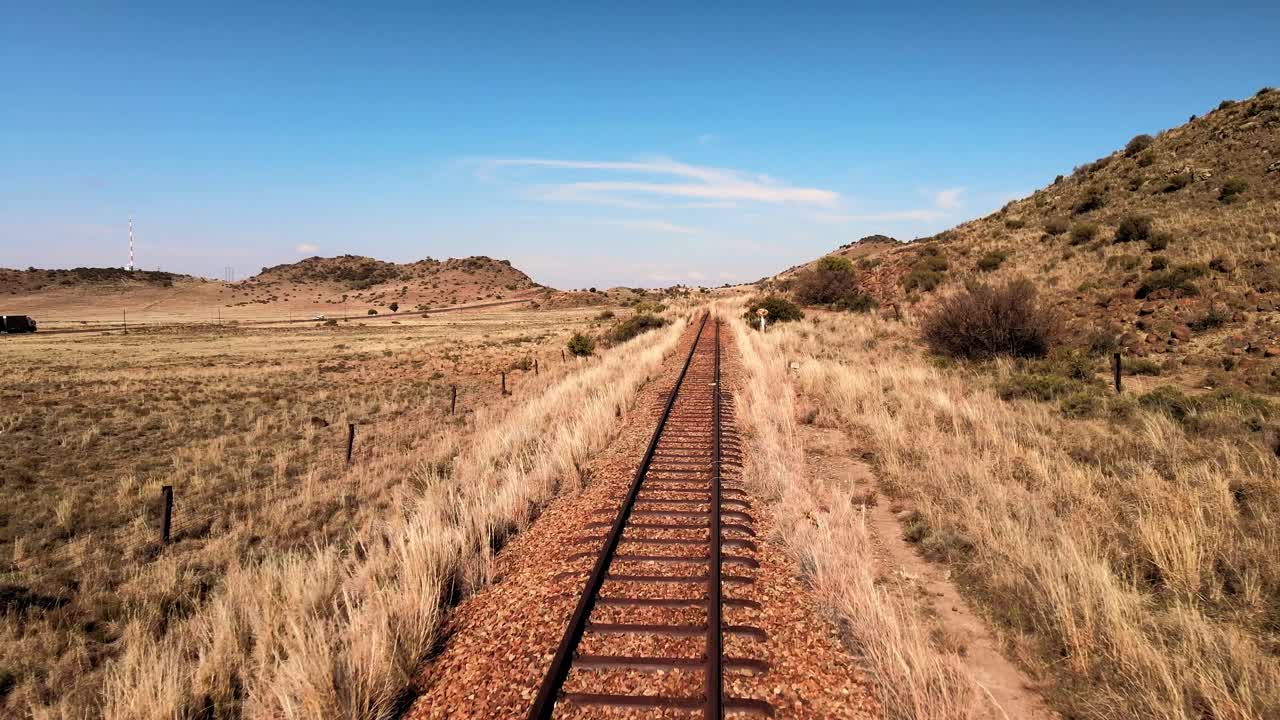 Abandoned railway amidst vast winter plains, rustic charm, and serene, panoramic countryside views, South Africa