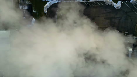 White-smoke-from-factory-chimney,-aerial-top-down-view