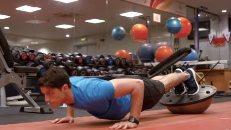 Man-doing-push-ups-on-bosu-ball