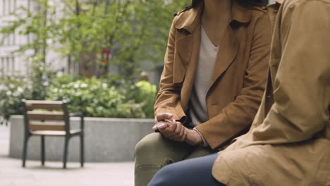 Close-Up-Of-Muslim-Couple-On-Date-Sitting-And-Talking-Together-On-City-Street