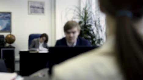 blurred office scene with colleagues