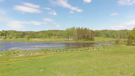 sunny day in kurzeme natural park in latvia, europe, aerial drone view