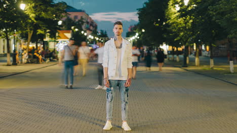 man in city street at night