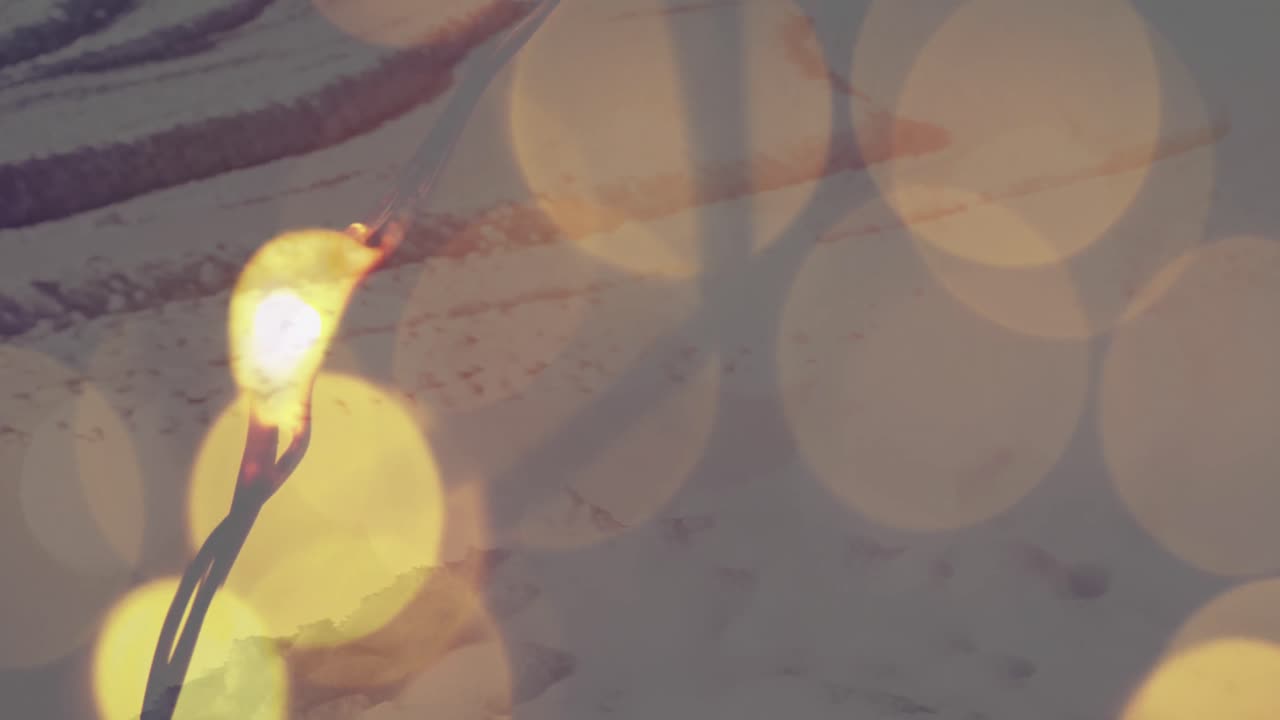 animación de puntos amarillos de luz con un paisaje de invierno en el fondo