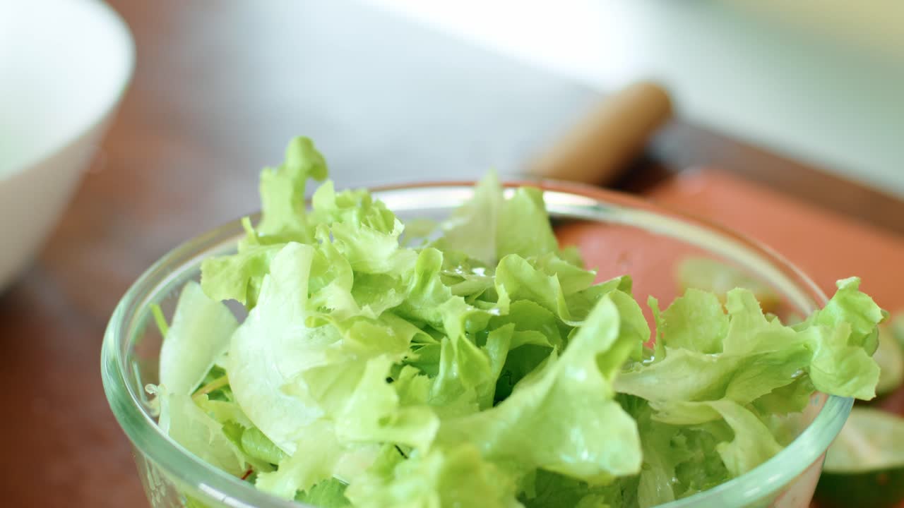 Preparing a Healthy Salad with Fresh Lime Juice