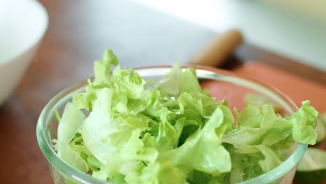 preparing a healthy salad with fresh lime juice
