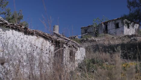 Old-stone-Cabin-in-wilderness-on-green-hill