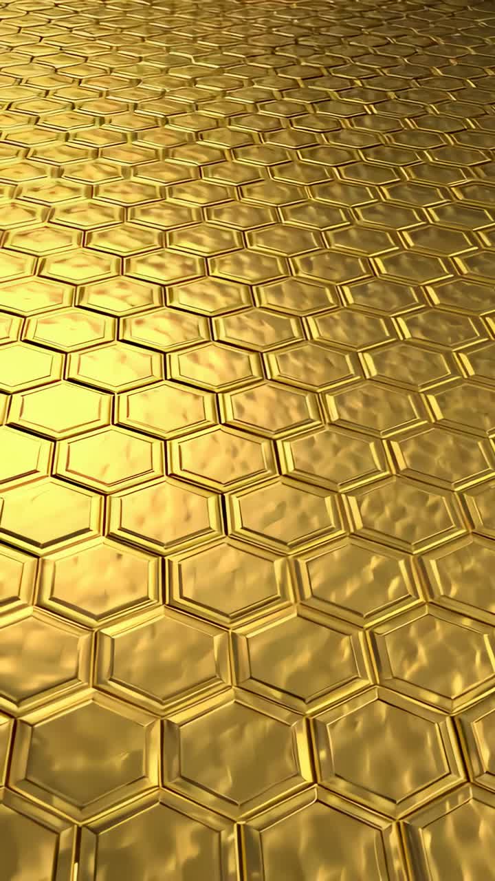 Vertical video: Pushing camera forward while tilting in studio, revealing gold hex tiles, glints