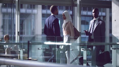 business people walking with luggage in the corridor at office 4k