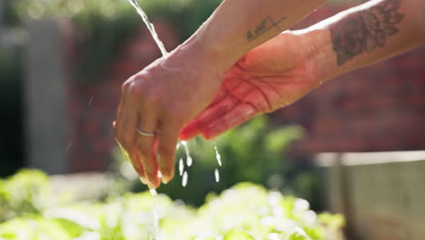 Outdoor,-water-and-hands-with-splash