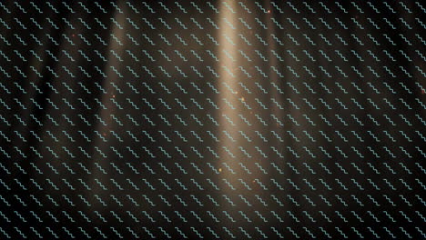 animation of pattern with rows of spinning shapes over glowing spots