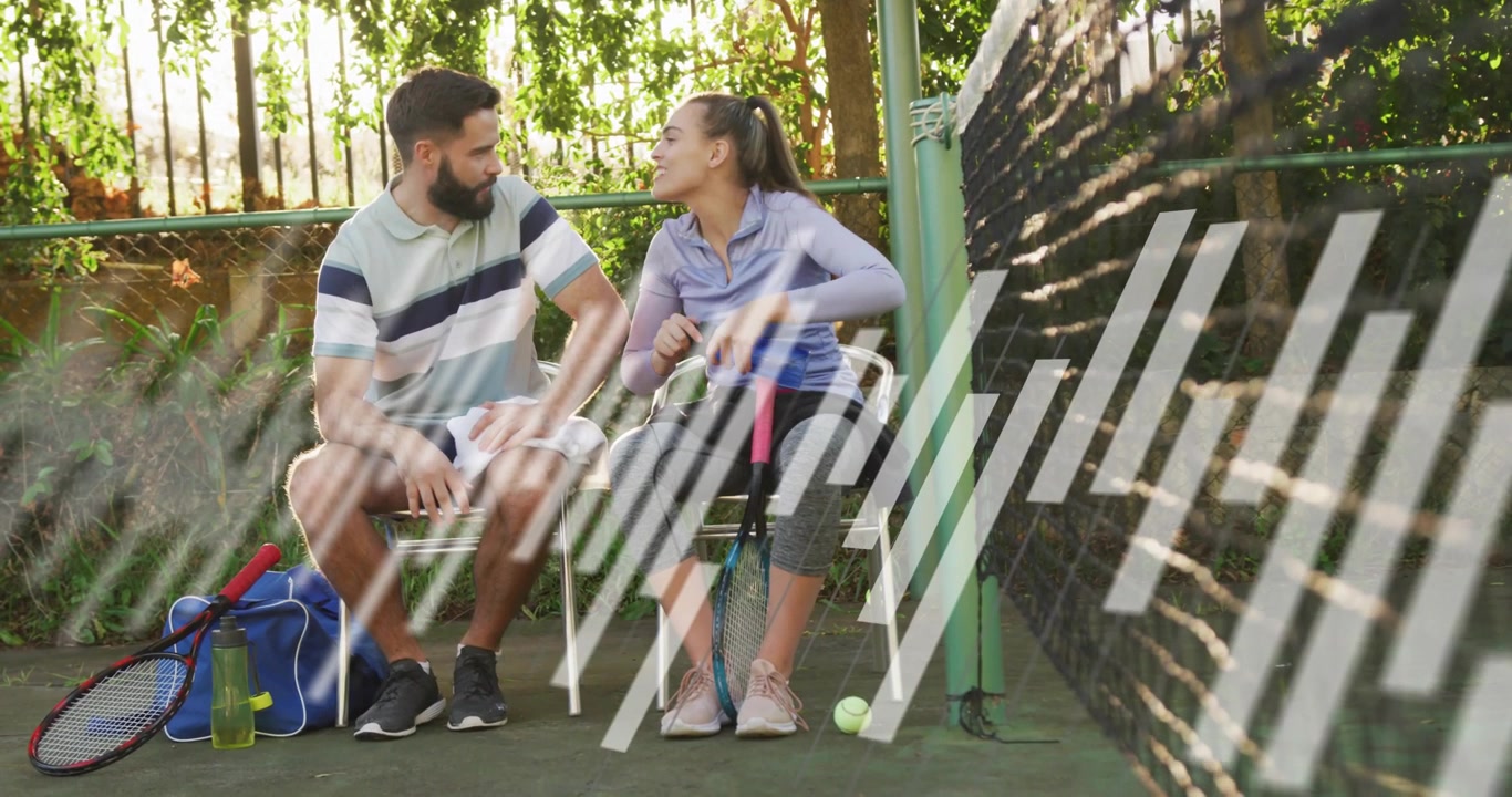 Vertical video: Couple on tennis court chatting, bars passing across, covering racket during break