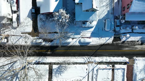 Aerial-truck-shot-of-snow-covered-street