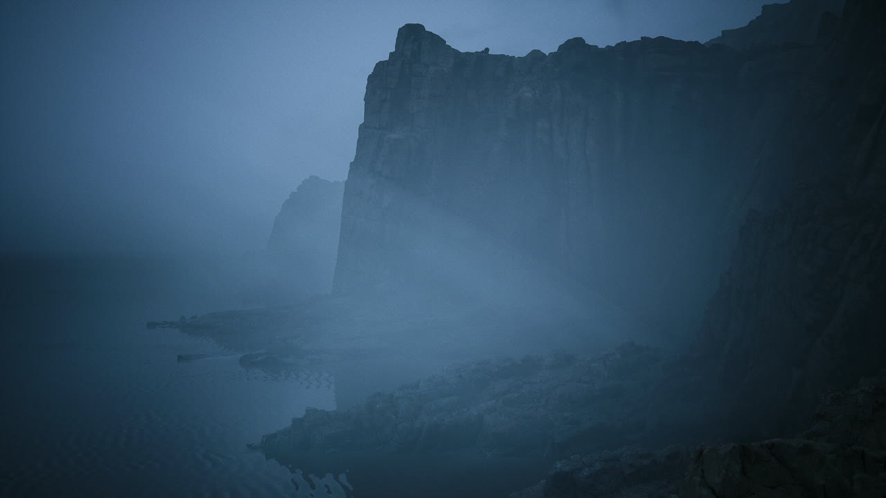 Misty cliffs by the ocean create an atmospheric landscape at dusk